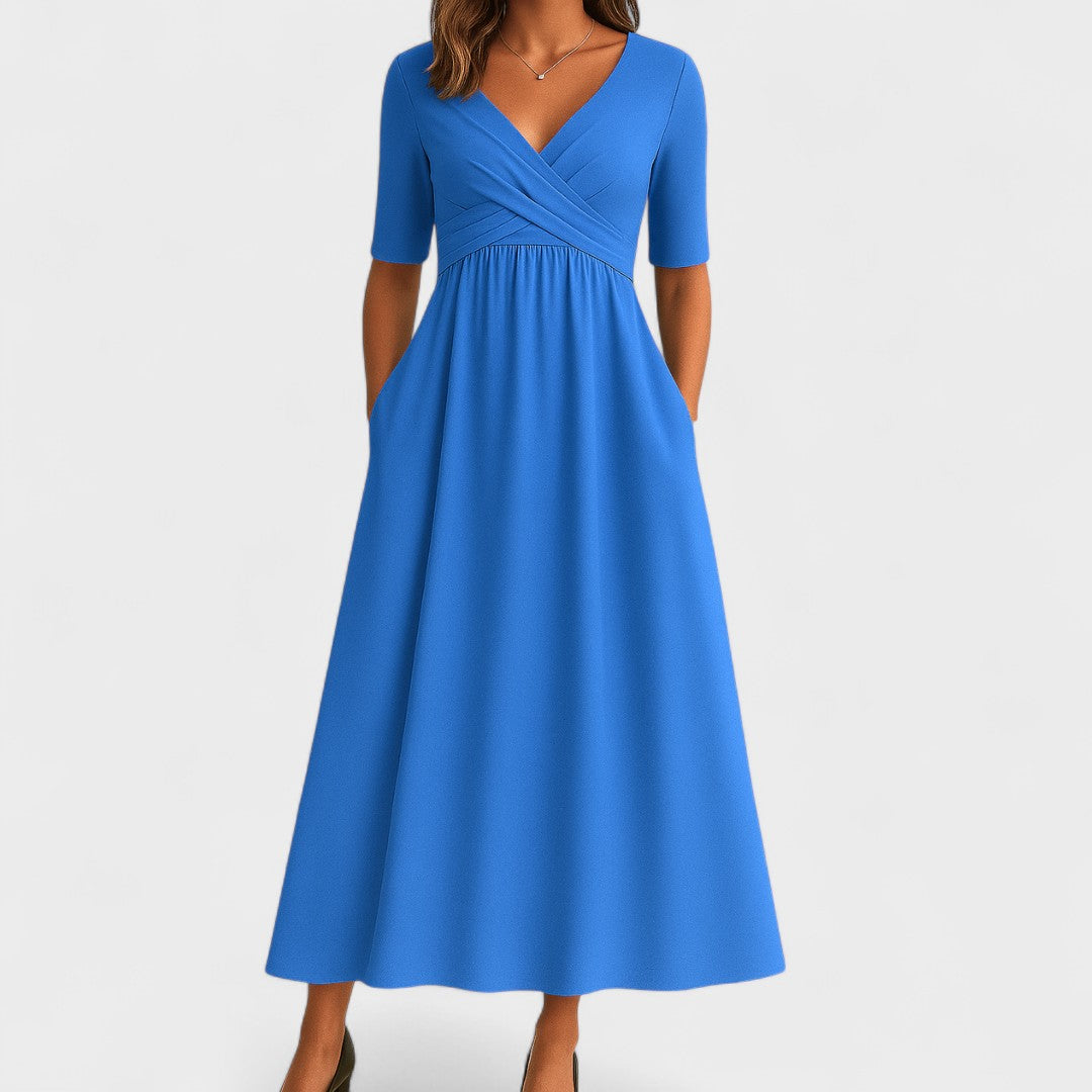Side view showing gathered waist and flowing maxi skirt