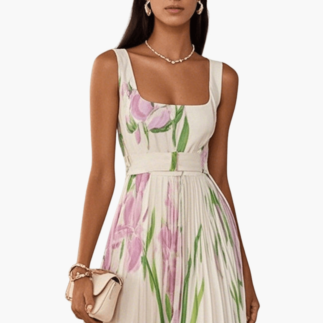 Side profile of floral maxi dress showing A-line pleated skirt and fitted bodice