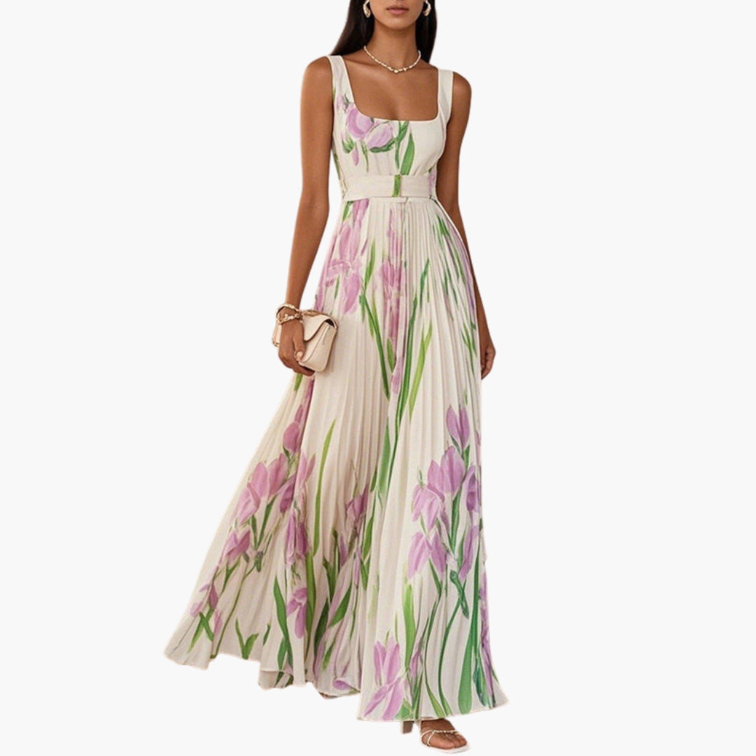 Woman wearing floral pleated maxi dress with square neckline, full front view