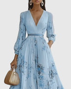 Back view showing sleeveless design and pleated drape