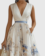 Model wearing floral maxi dress, full-length side pose