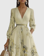 V-neckline and shoulder detail on pleated maxi dress