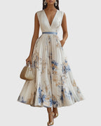 Women's floral pleated maxi dress front view, sleeveless V-neckline