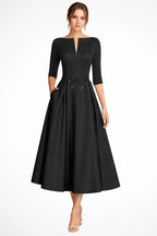 Model turning, showcasing the A-line skirt flow