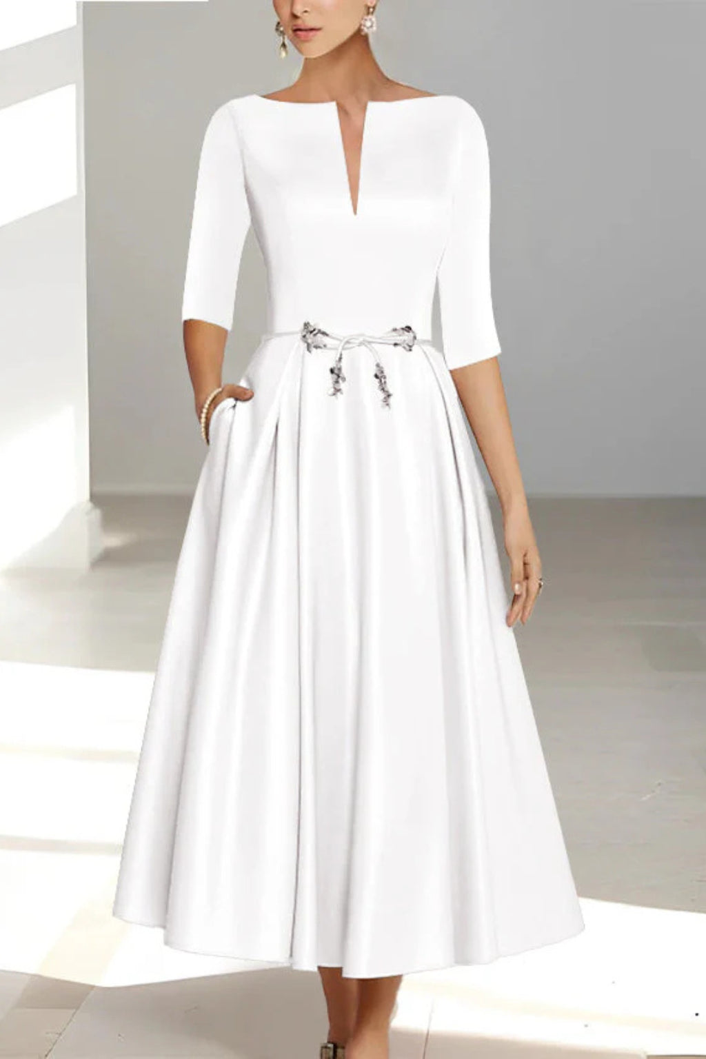 Close-up of metallic waist embellishment and tie