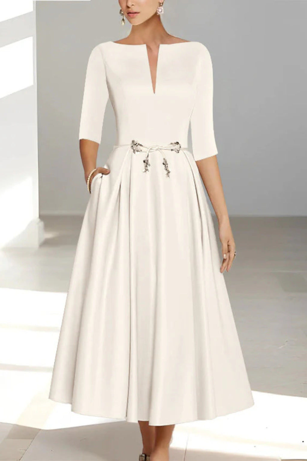 Bride in pleated A-line midi wedding dress, full-length pose
