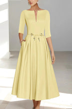 Detail shot of structured half sleeve and bateau neckline