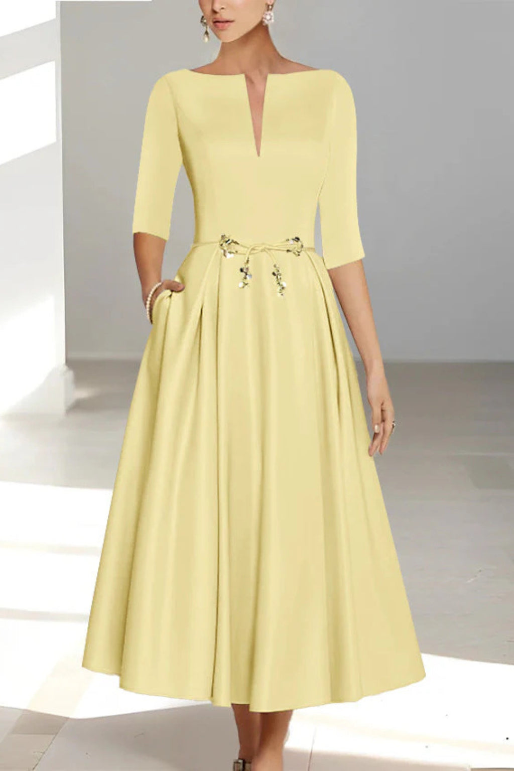 Detail shot of structured half sleeve and bateau neckline