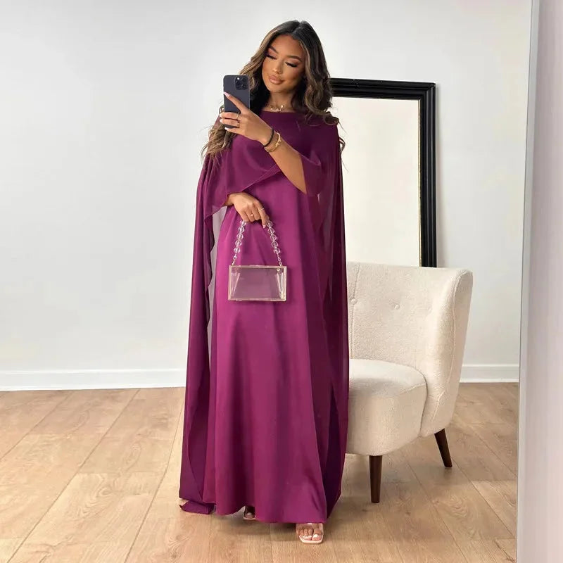 Side profile of floor-length maxi dress showing flowing silhouette