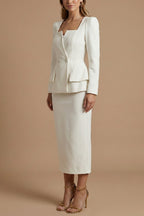 Close-up detail of double-breasted buttons and peplum hem
