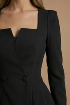 Model in blazer set, standing three-quarter angle