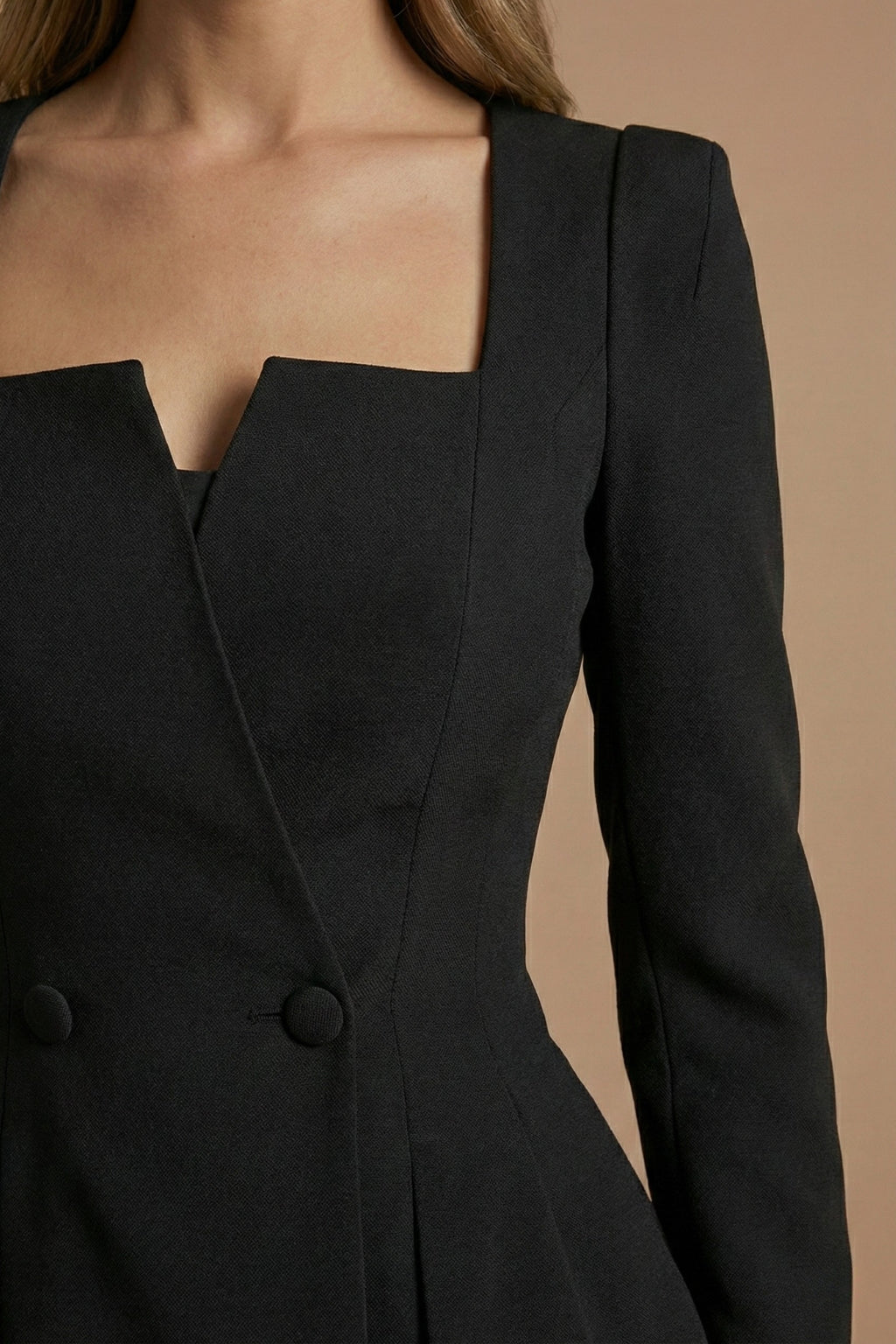 Model in blazer set, standing three-quarter angle