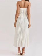 Side view showing vertical pleating and waist definition