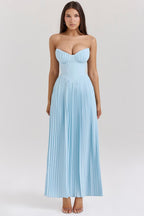 Back view of strapless midi dress with flowing pleated skirt