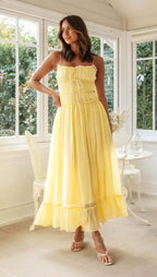 Back view displaying lace-up ties and cascading ruffle tiers