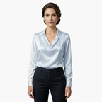 Side profile of model wearing cowl neck blouse