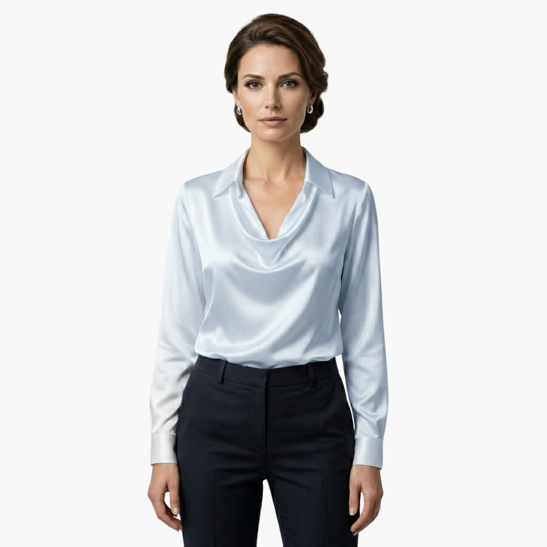 Side profile of model wearing cowl neck blouse