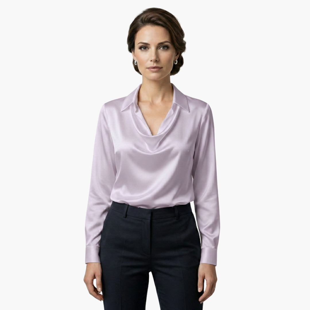Model turning, showing blouse from different angle