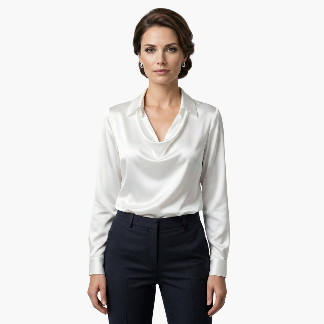 Model wearing satin cowl neck blouse, standing pose