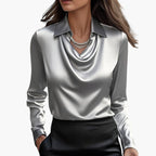 Sleeves and shoulder detail of satin blouse