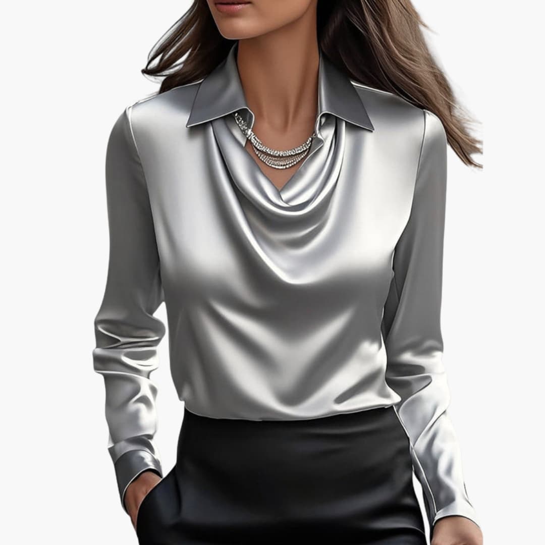 Sleeves and shoulder detail of satin blouse