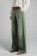 Back view of khaki green wide leg jeans showing fit and length