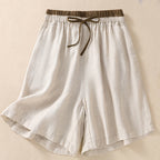 Side profile of relaxed fit shorts on model