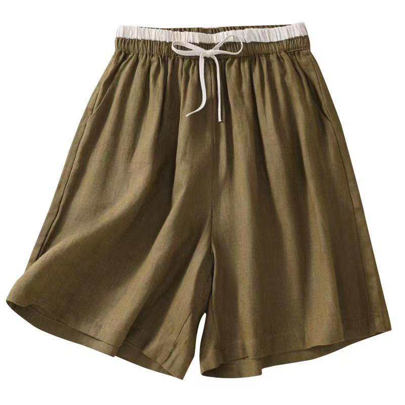 Flat lay of folded linen shorts