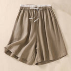 Women's relaxed knee-length shorts in natural linen, front view