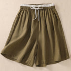 Model in relaxed pose, shorts detail view