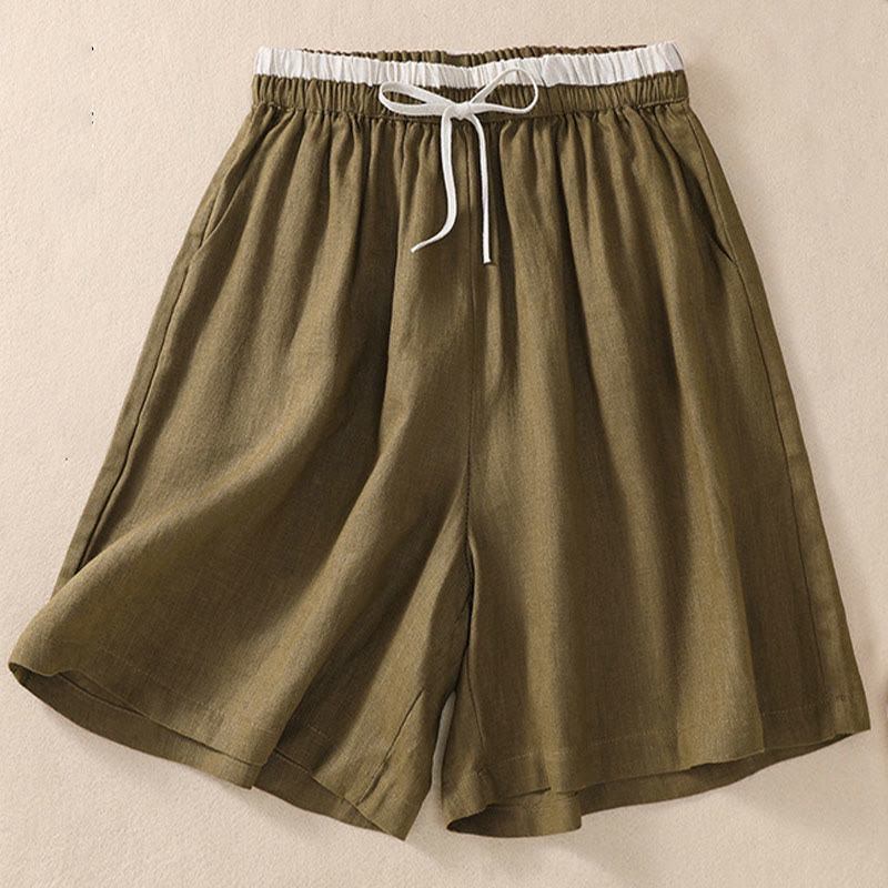 Model in relaxed pose, shorts detail view