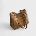 Side profile of slouchy bag shape and fabric construction