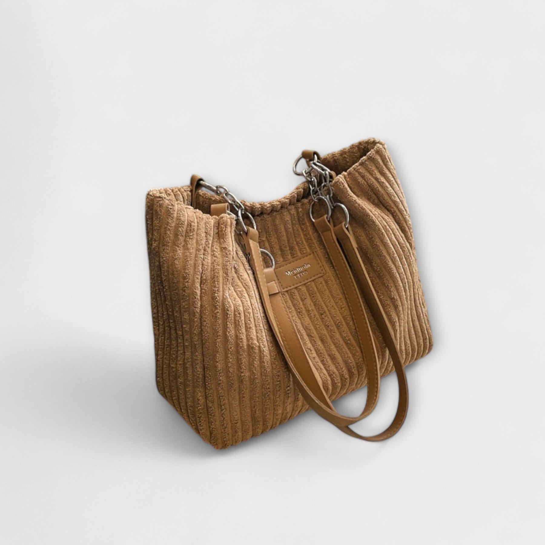 Side profile of slouchy bag shape and fabric construction