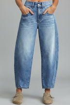 Model wearing barrel leg jeans, standing pose showing full length silhouette