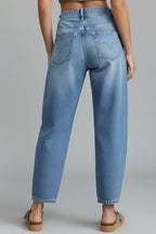 Back view of mid rise barrel leg jeans showing five-pocket design