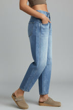 Side angle of barrel leg jeans highlighting contemporary fit and fading detail