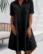 Model in denim midi dress, standing pose showing A-line silhouette