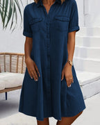 Close-up of button-front closure and chest pocket details