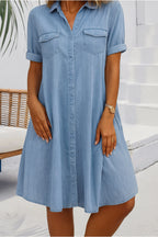 Woman wearing denim button-front midi dress, full-length front view