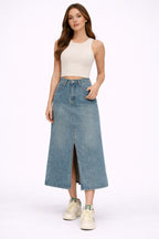 Light blue denim maxi skirt with front split, displayed flat
