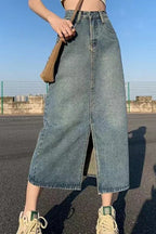 Woman wearing light blue denim maxi skirt, front view standing
