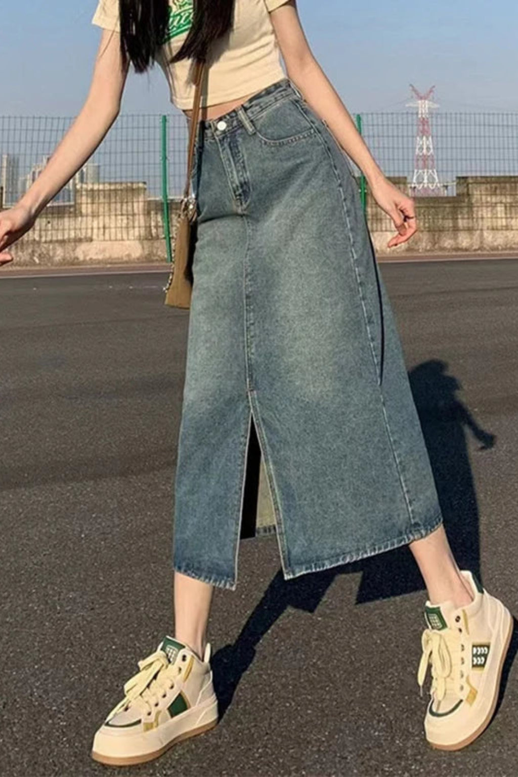 Side view of denim maxi skirt showing A-line silhouette