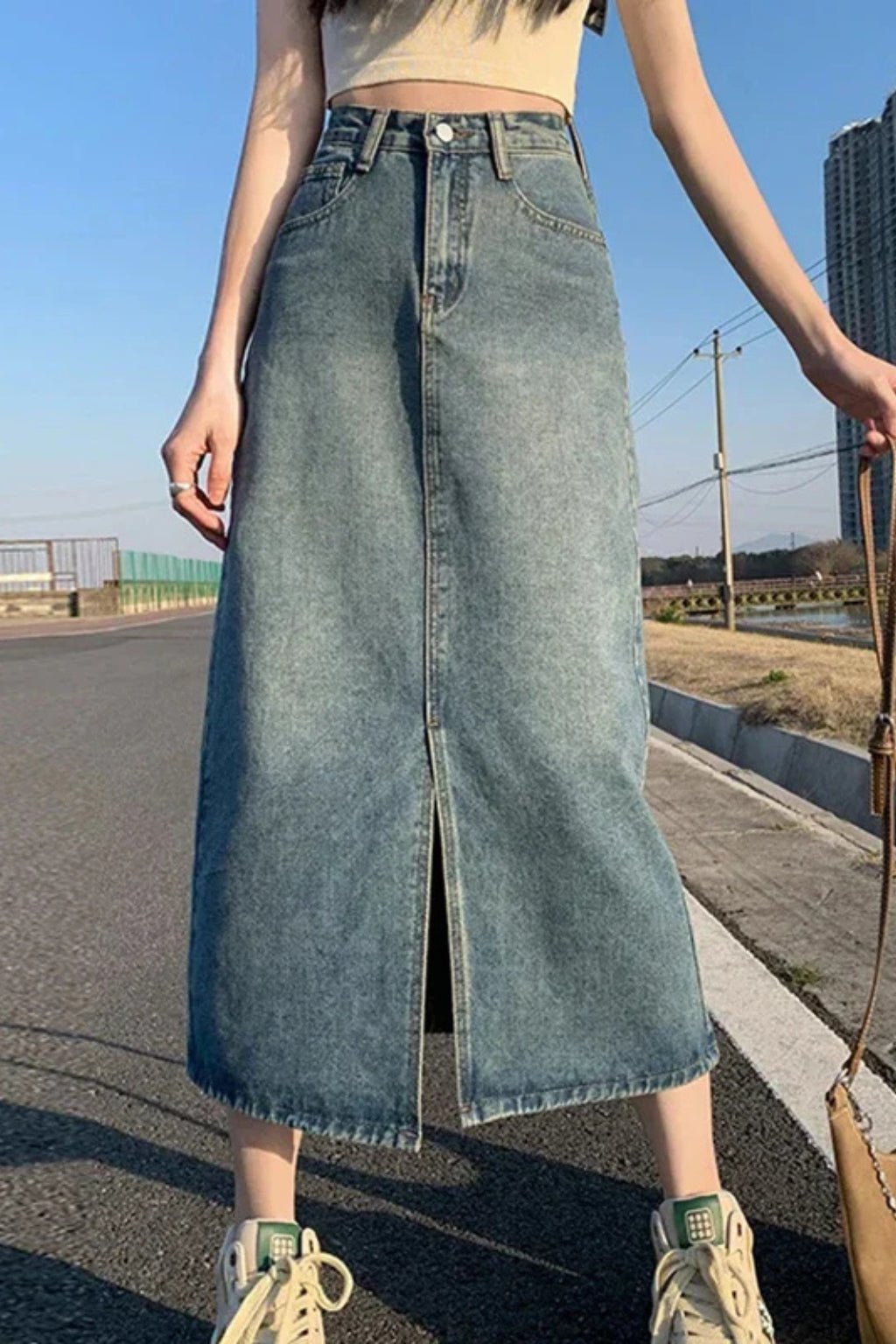Back view of light blue denim maxi skirt