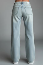 Close-up of vintage wash detail and fading on light blue denim fabric