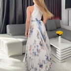 Model in floral dress at natural light, outdoor setting