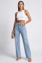 Model wearing light blue straight leg jeans, side profile pose