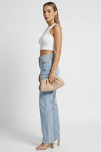 Back view of light blue denim jeans showing fit and silhouette