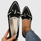 Close-up of knit textile and bow feature on loafer
