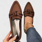 Side profile of light blue loafer showing bow vamp detail