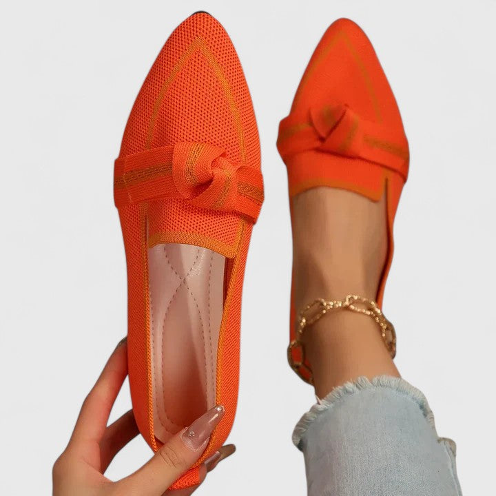 Top-down view of light blue loafer showing arch support
